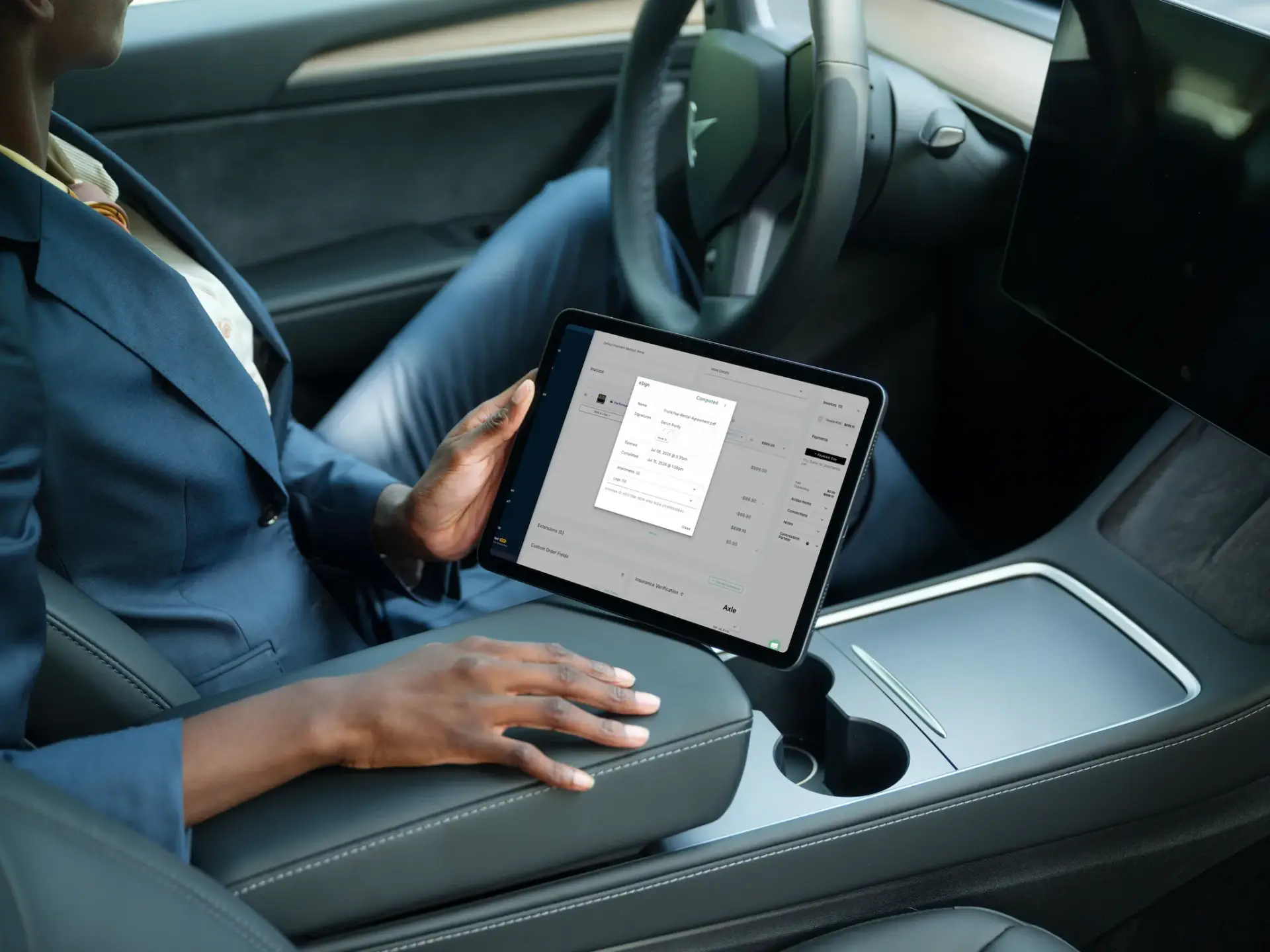 User signing a rental agreement