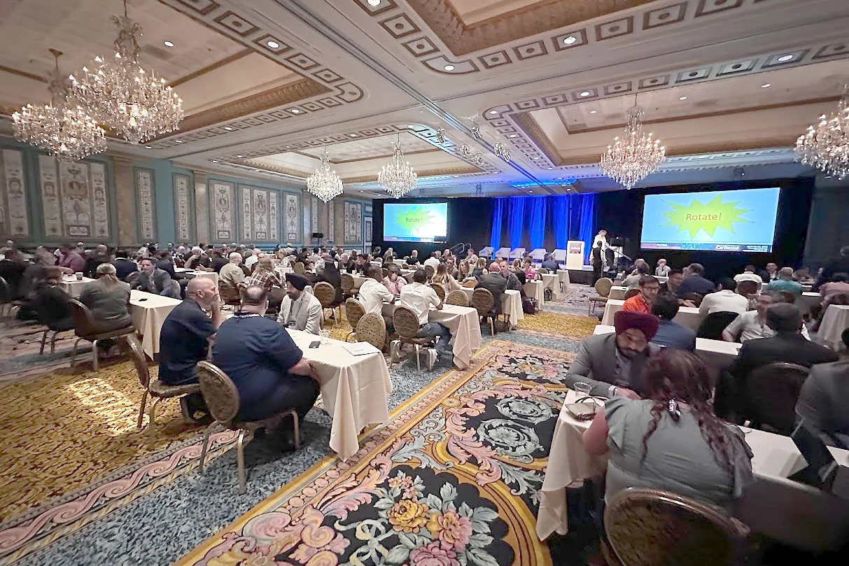 Ballroom full of tables during a speed-networking session